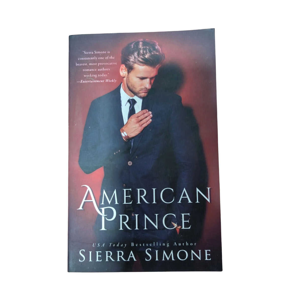 Front cover of American Prince by Sierra Simone, the second book in the New Camelot trilogy featuring a passionate romance involving Embry Moore, Ash and Greer