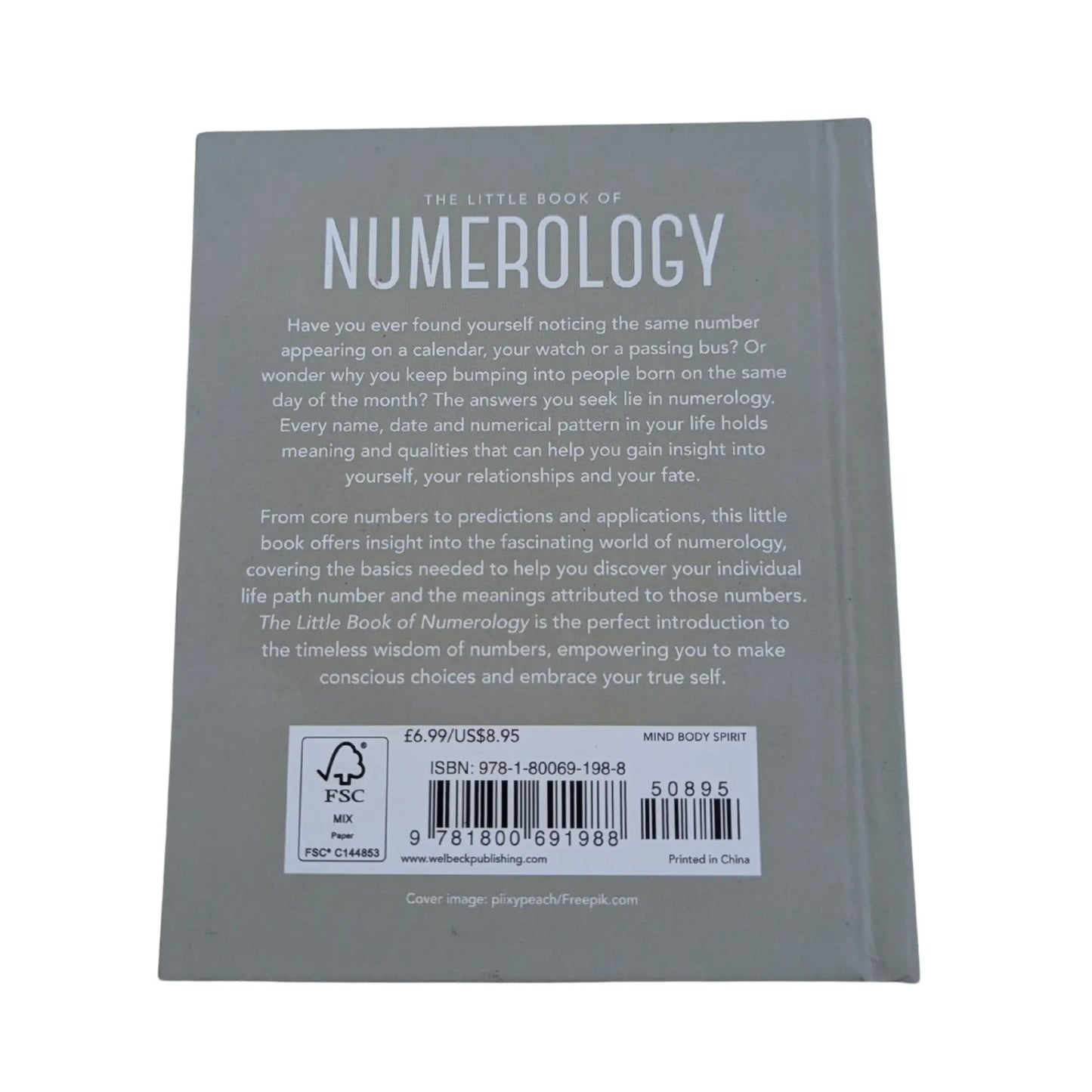 View of the back cover and ISBN information for this authentic imported copy of The Little Book of Numerology.