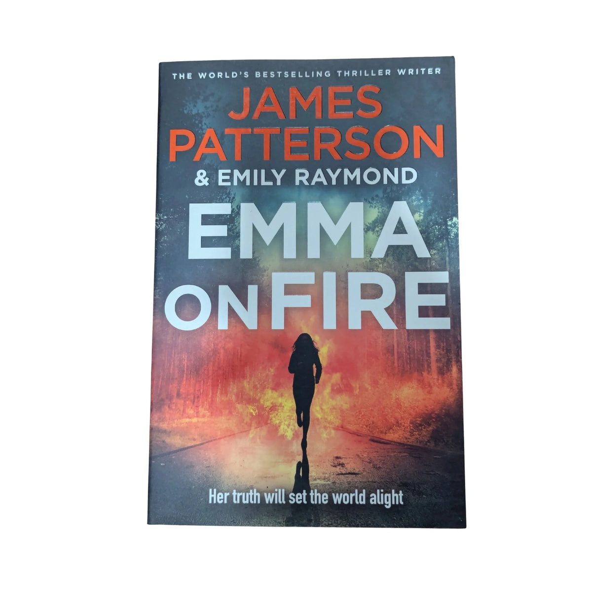 Front cover of Emma on Fire by James Patterson and Emily Raymond, a thriller about a young student determined to change the world after a family tragedy