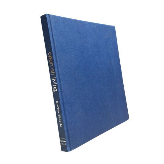 Blue book titled 'Open Air Living' by Eduard Stahlke on a white background