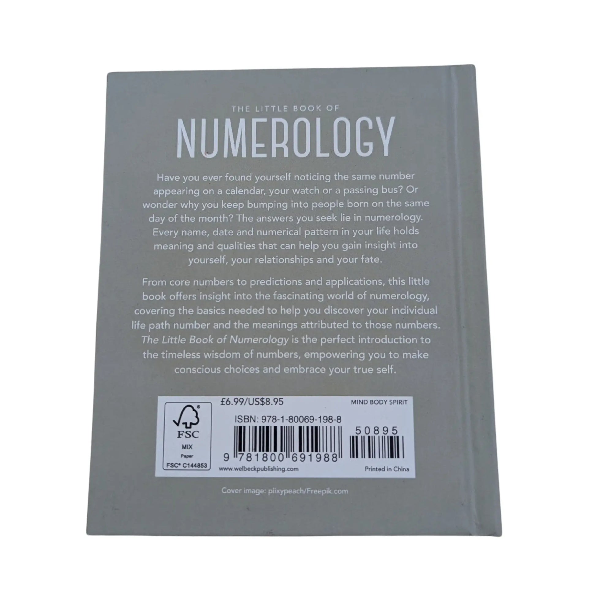 View of the back cover and ISBN information for this authentic imported copy of The Little Book of Numerology.
