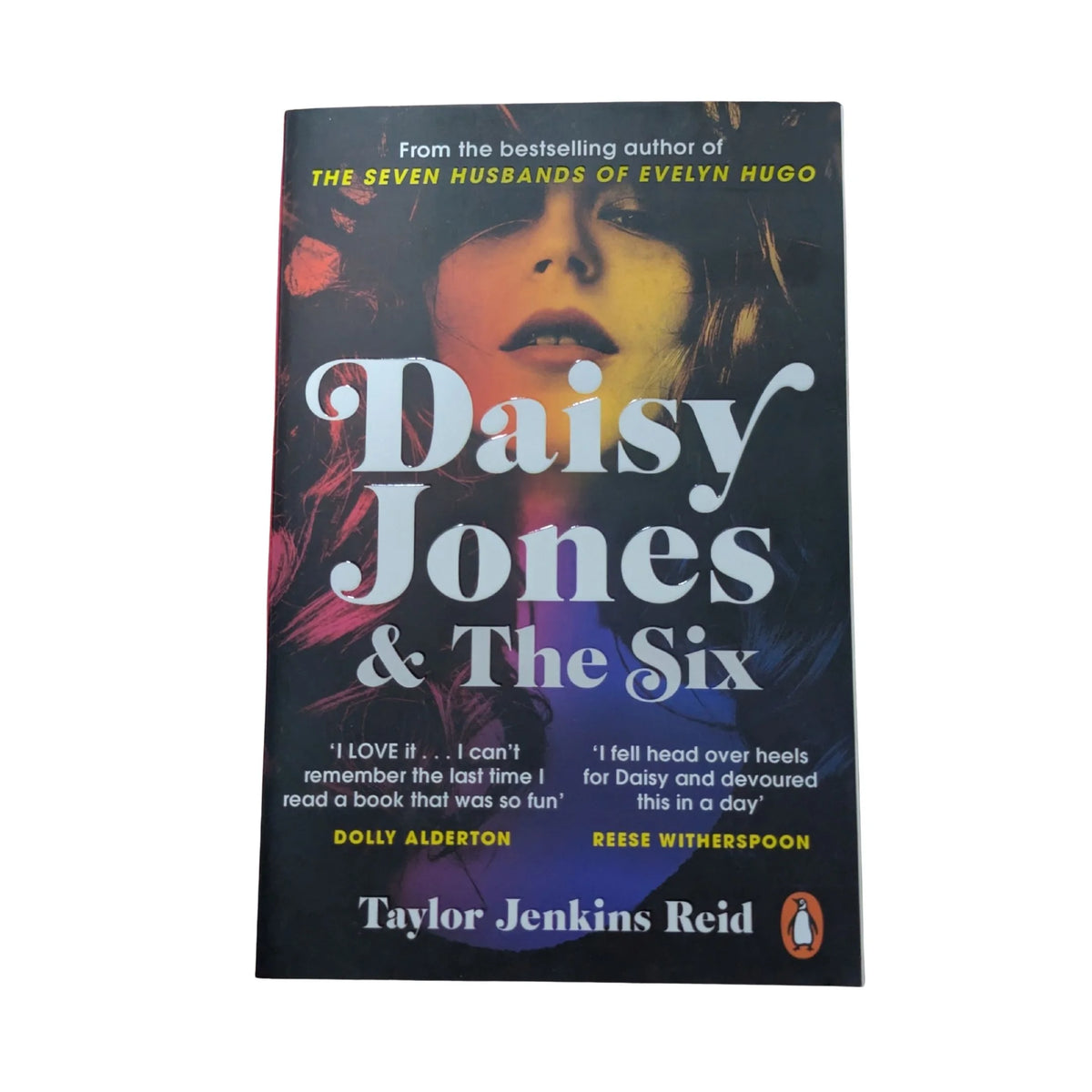 Front cover of Daisy Jones & The Six by Taylor Jenkins Reid, a 1970s rock-and-roll novel about a fictional band's rise to fame, romance and secrets