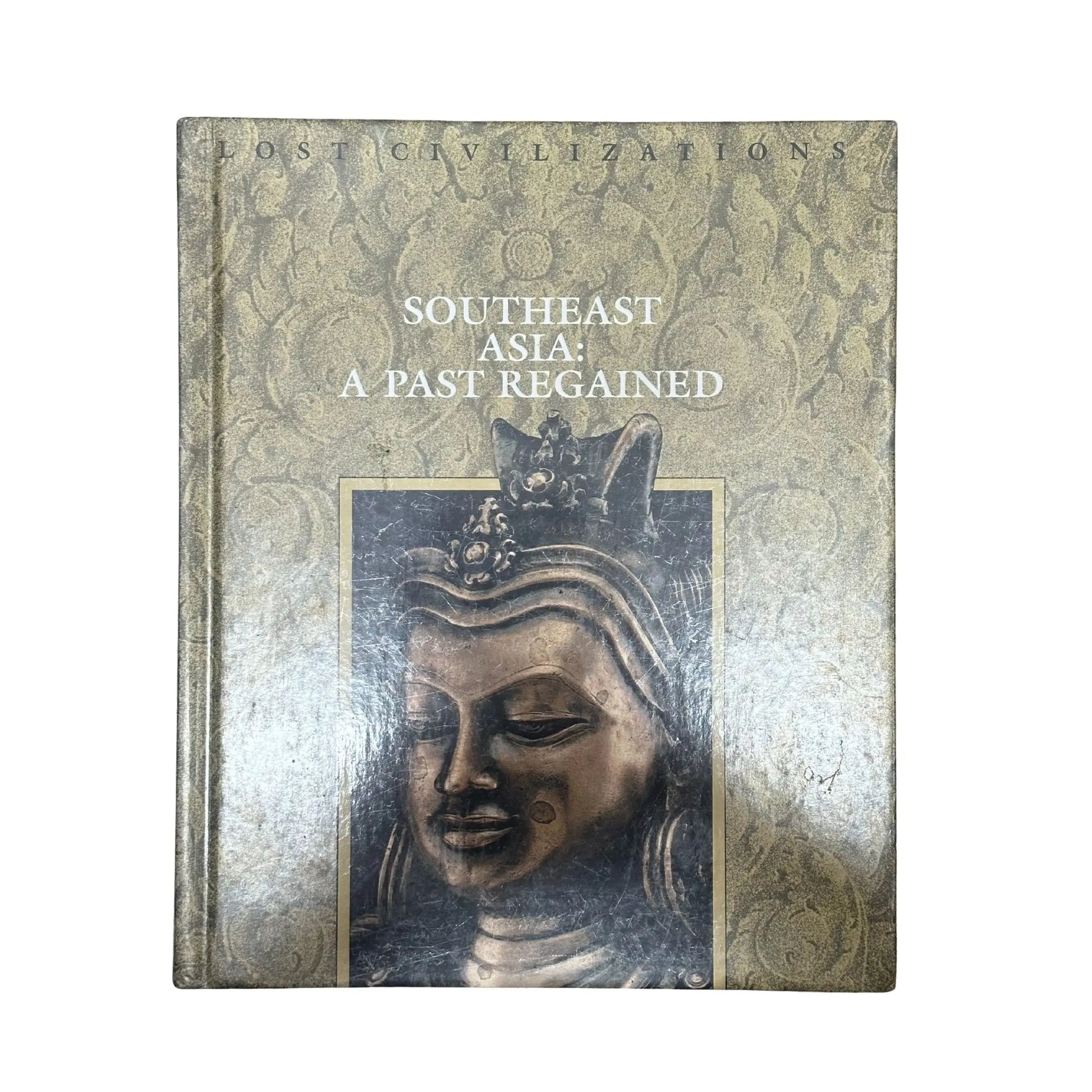 Book titled 'Southeast Asia: A Past Regained' with a decorative cover featuring an image of a statue.
