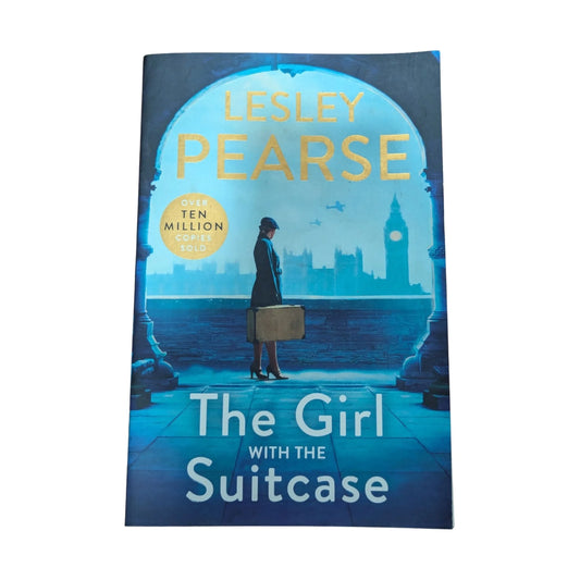 Front cover of The Girl with the Suitcase by Lesley Pearse, a historical fiction novel set in wartime London about mistaken identity and a chance for a new life
