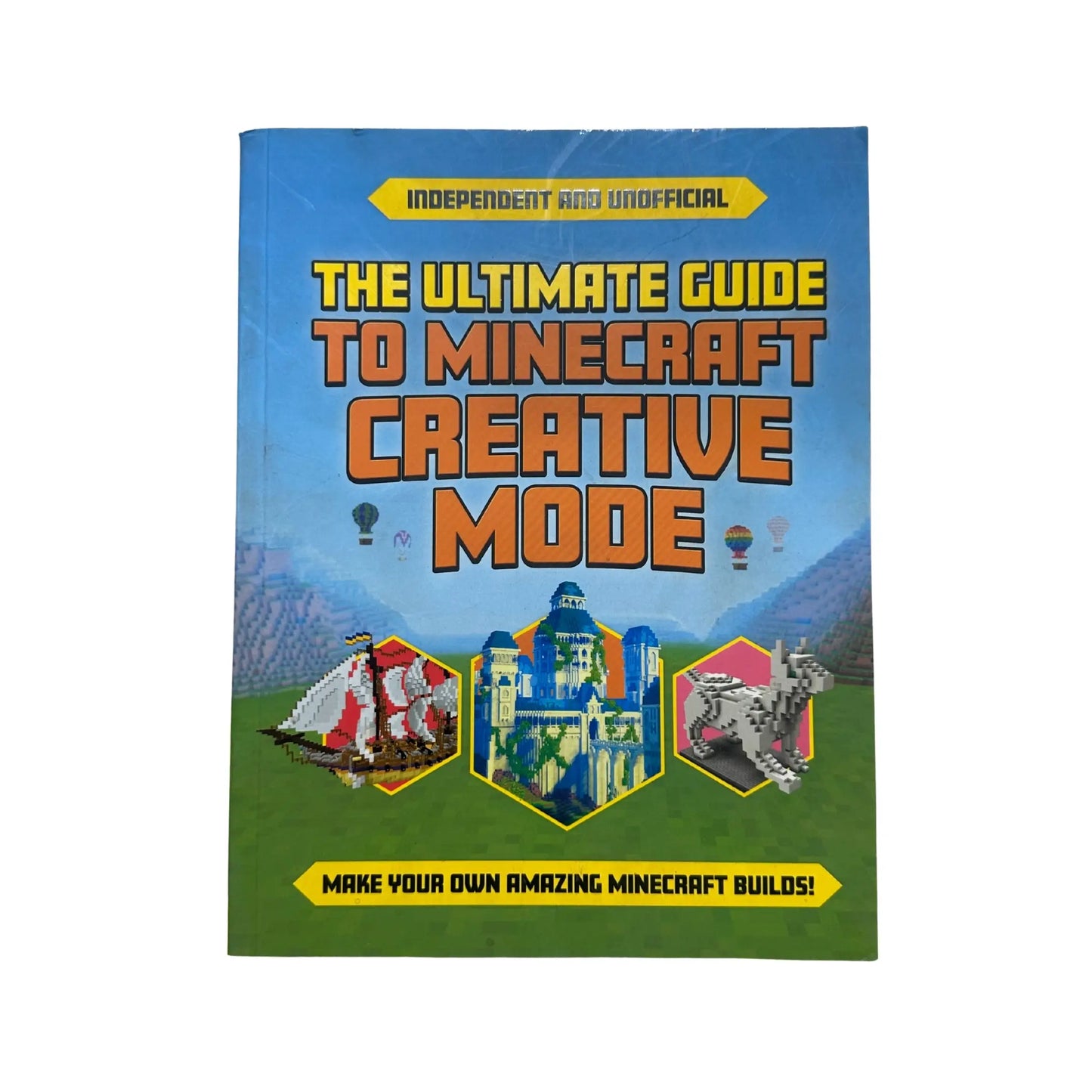 Book titled 'The Ultimate Guide to Minecraft Creative Mode' on a white background