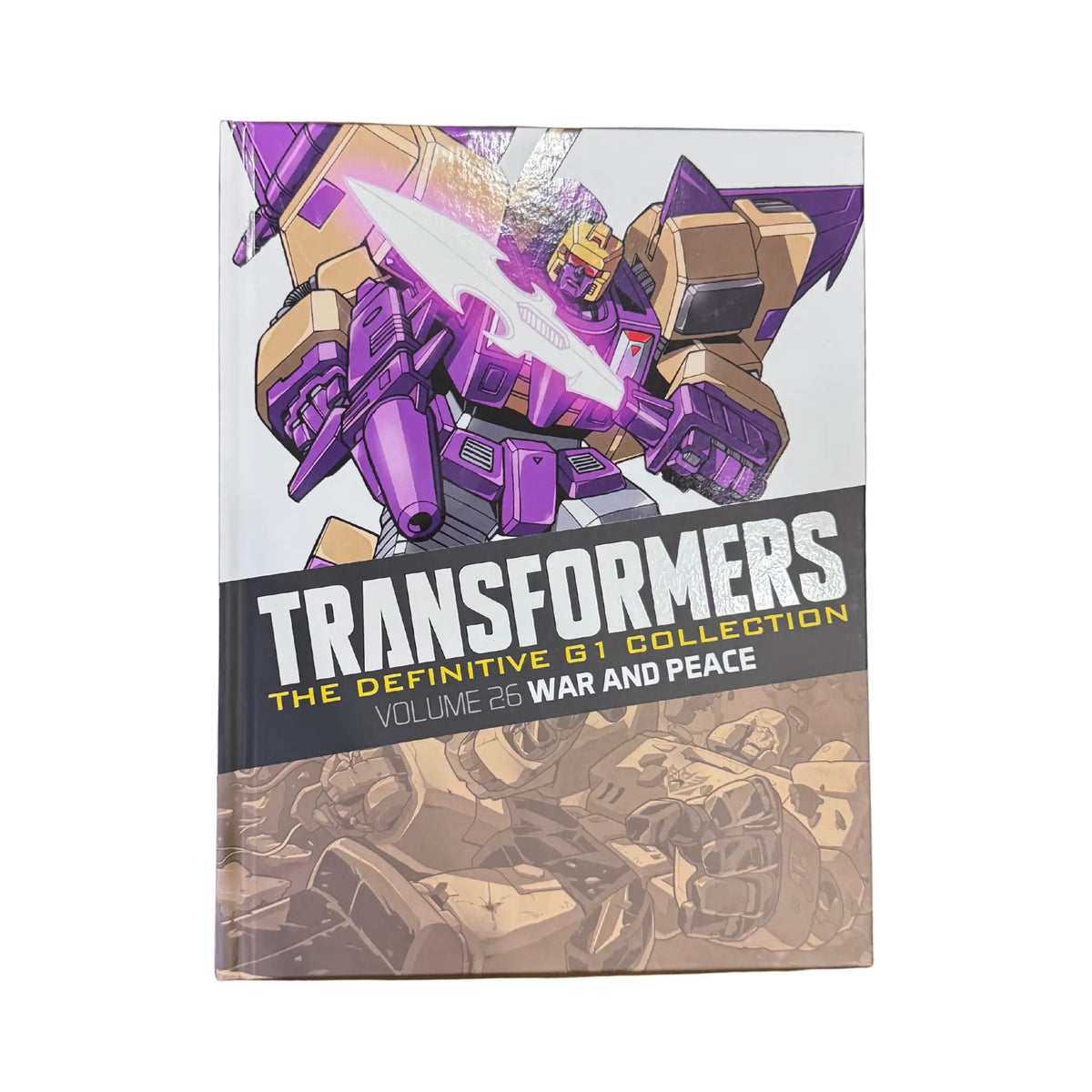 The front cover of Transformers The Definitive G1 Collection Vol. 26: War and Peace, available as an original imported copy at Generation Books Collection Pakistan.